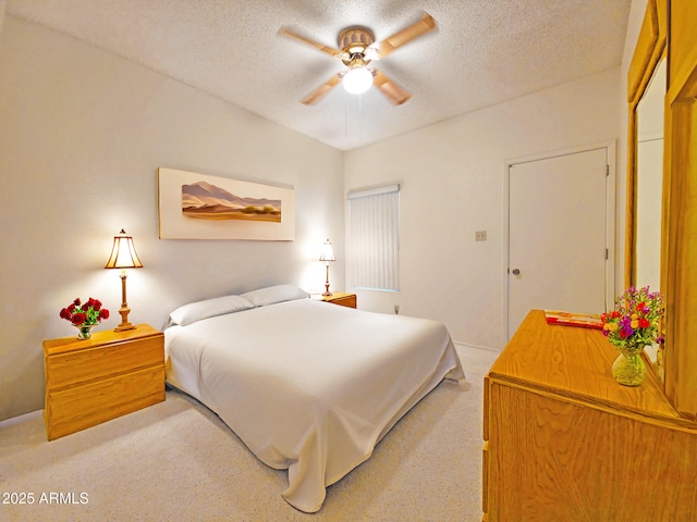 carpeted bedroom with baseboards and a textured ceiling