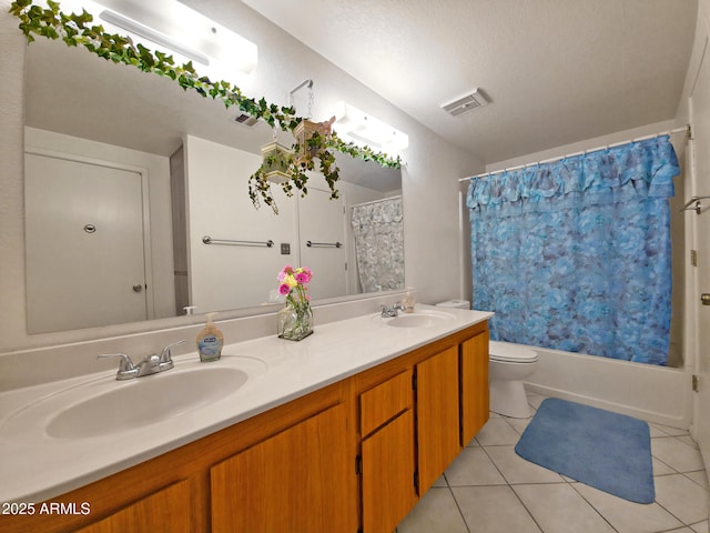 full bathroom featuring tile patterned flooring, a sink, and visible vents