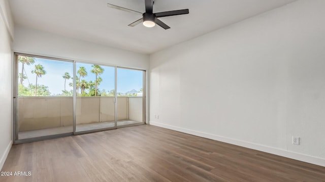 empty room featuring hardwood / wood-style floors and ceiling fan