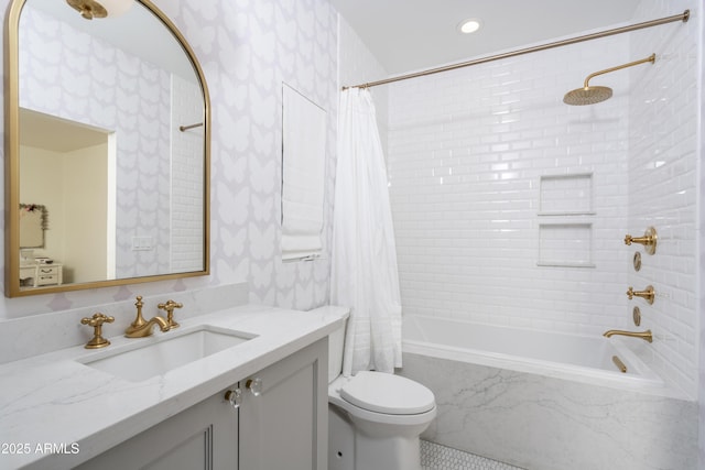 bathroom with shower / bath combo with shower curtain, toilet, vanity, and wallpapered walls