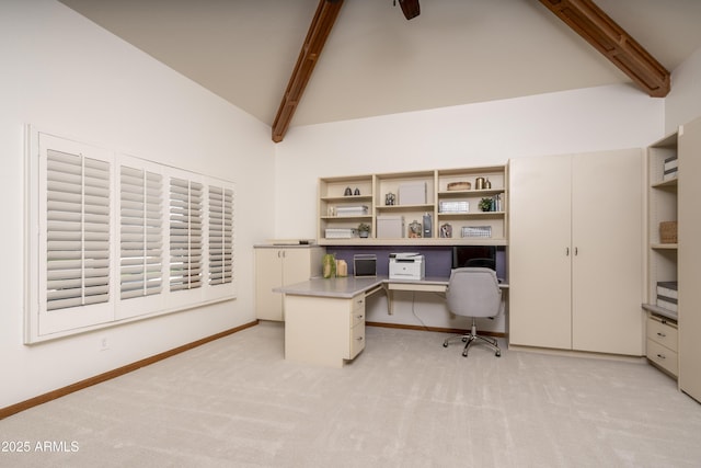 office with beamed ceiling, baseboards, high vaulted ceiling, and light colored carpet