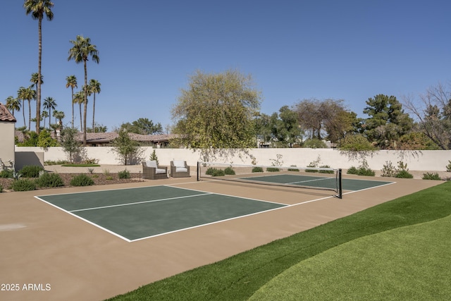 view of tennis court featuring fence