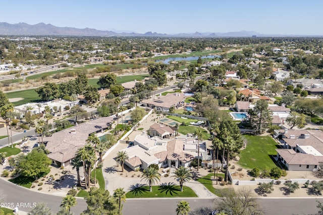 birds eye view of property with a residential view and a water and mountain view