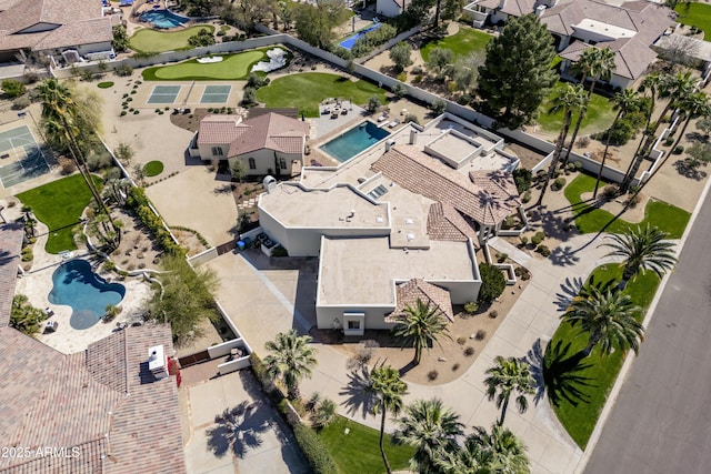 birds eye view of property with a residential view