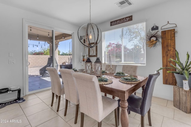 tiled dining room featuring a wealth of natural light