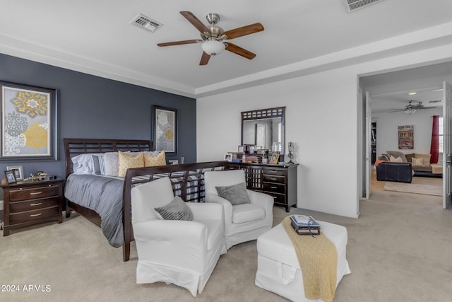 bedroom with light colored carpet and ceiling fan