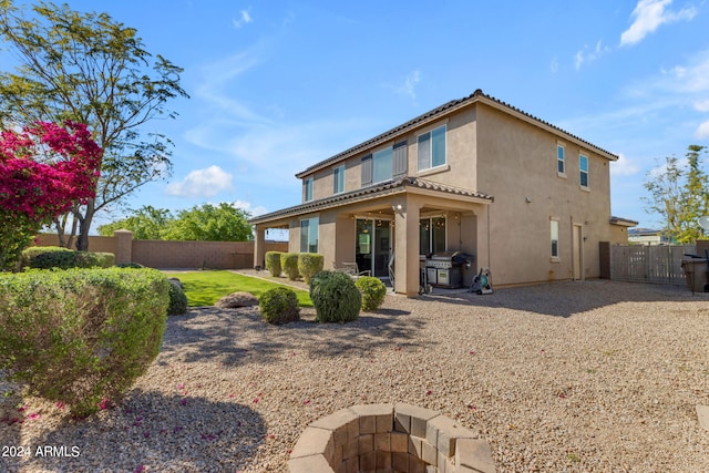 rear view of house featuring a patio area