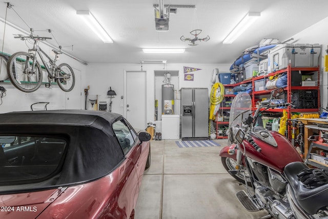 garage featuring stainless steel fridge with ice dispenser