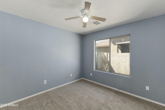 carpeted empty room featuring ceiling fan