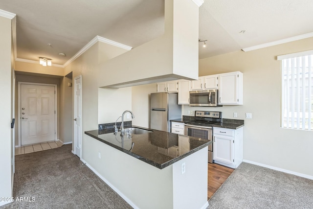 5401 E Van Buren St Unit 3048, Phoenix, AZ 85008 - kitchen with appliances with stainless steel finishes, a sink, white cabinets, a peninsula, and baseboards