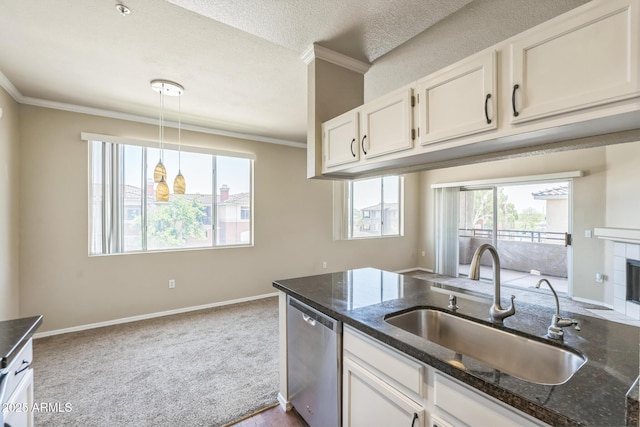 5401 E Van Buren St Unit 3048, Phoenix, AZ 85008 - kitchen with stainless steel dishwasher, a sink, ornamental molding, white cabinets, and dark stone countertops