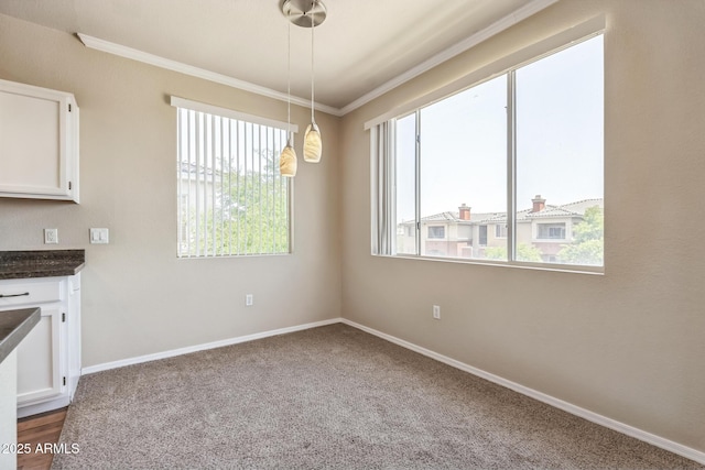 5401 E Van Buren St Unit 3048, Phoenix, AZ 85008 - unfurnished dining area featuring ornamental molding, baseboards, and dark carpet