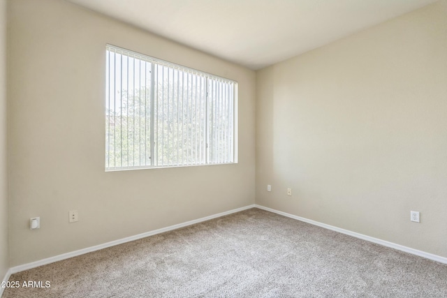 5401 E Van Buren St Unit 3048, Phoenix, AZ 85008 - carpeted empty room featuring plenty of natural light and baseboards
