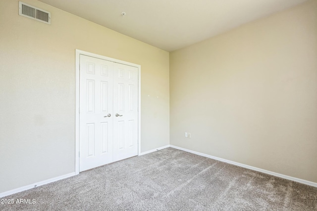 5401 E Van Buren St Unit 3048, Phoenix, AZ 85008 - unfurnished bedroom with carpet floors, baseboards, and a closet