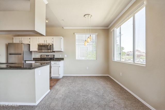 5401 E Van Buren St Unit 3048, Phoenix, AZ 85008 - kitchen with stainless steel appliances, dark countertops, white cabinetry, baseboards, and ornamental molding