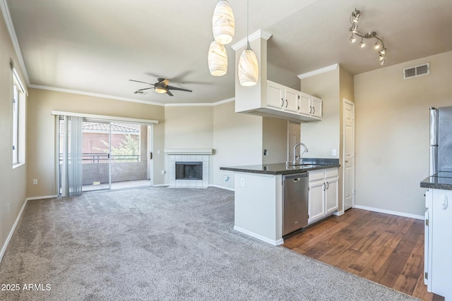 5401 E Van Buren St Unit 3048, Phoenix, AZ 85008 - kitchen with stainless steel appliances, a sink, dark countertops, a ceiling fan, and ornamental molding