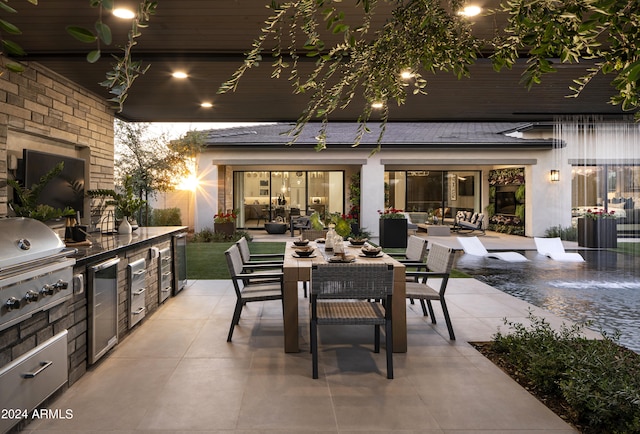 view of patio with area for grilling, a grill, outdoor lounge area, and outdoor dining area