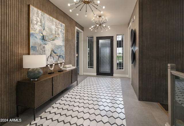 foyer entrance featuring a notable chandelier