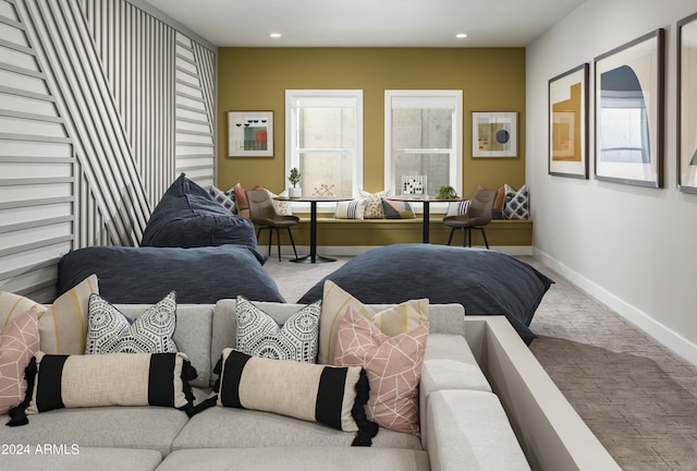 living area featuring recessed lighting, baseboards, a healthy amount of sunlight, and carpet flooring