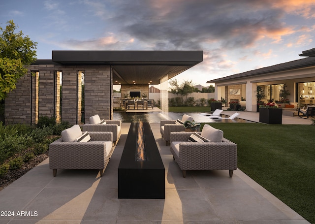 view of patio / terrace featuring outdoor dining space, an outdoor living space with a fire pit, and fence