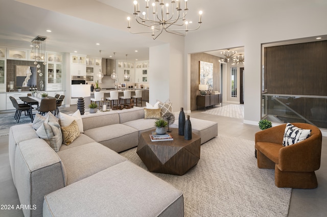 living room featuring a chandelier, recessed lighting, and baseboards