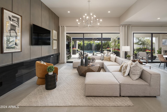 living area featuring recessed lighting and an inviting chandelier