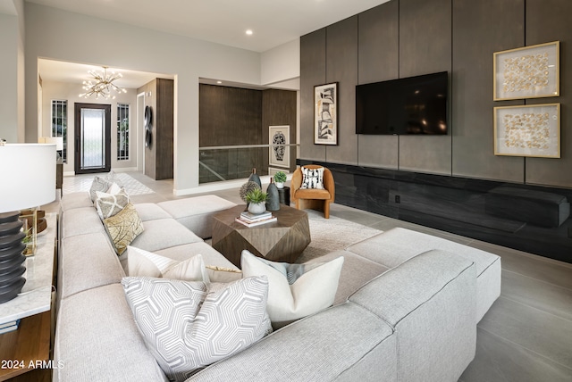 living room featuring recessed lighting and an inviting chandelier