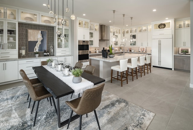 dining room with light tile patterned floors and recessed lighting