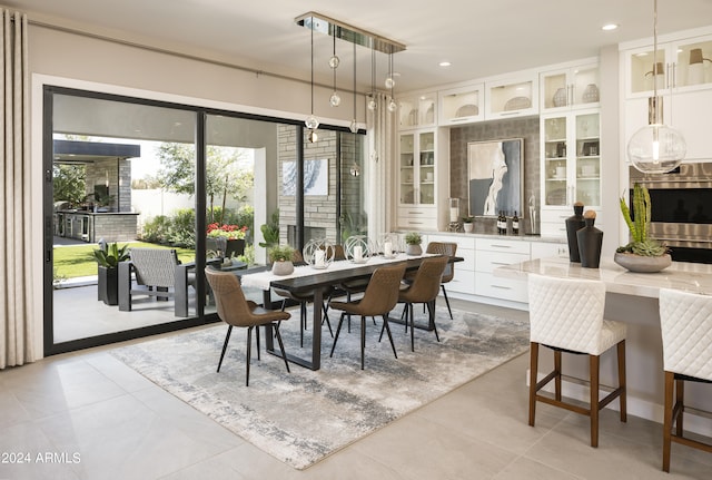 dining room featuring light tile patterned flooring and recessed lighting