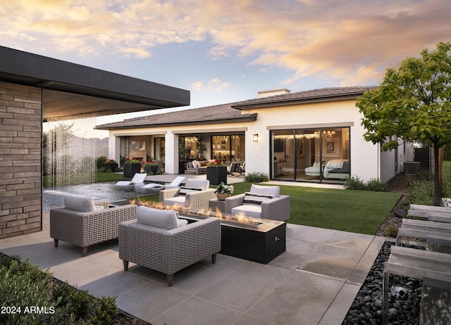 view of patio / terrace featuring an outdoor living space with a fire pit and central AC unit