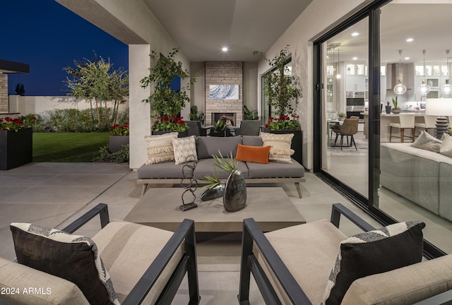 view of patio / terrace featuring an outdoor living space with a fireplace