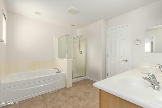 full bathroom featuring tile patterned floors, a garden tub, a stall shower, a sink, and double vanity