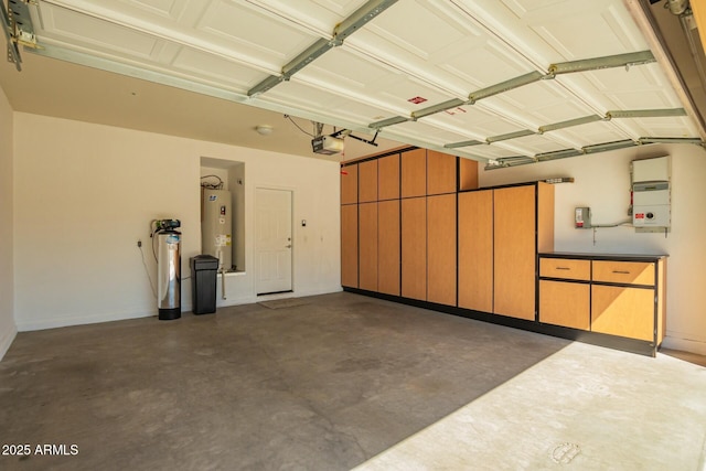 garage with baseboards, a garage door opener, and water heater