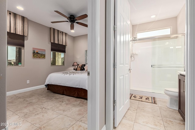 bedroom featuring ensuite bath and ceiling fan