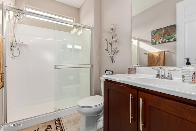 bathroom with tile patterned flooring, vanity, toilet, and an enclosed shower