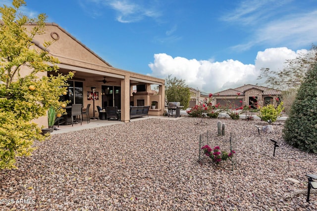 view of yard with ceiling fan and a patio