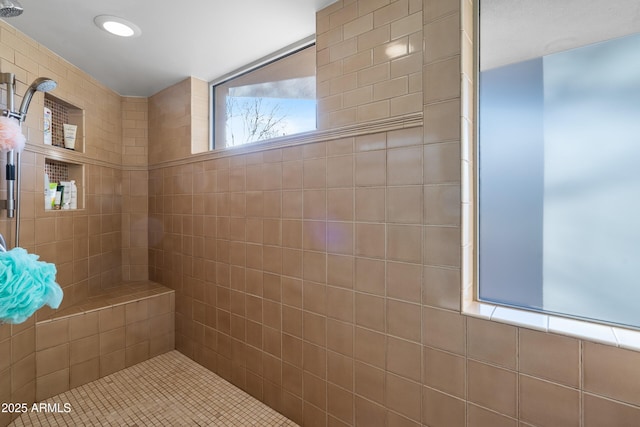 bathroom featuring a tile shower