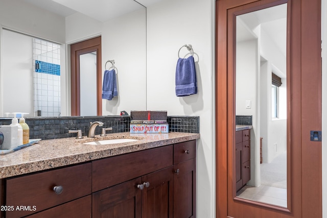 bathroom with backsplash and vanity