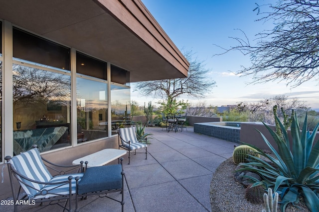 view of patio / terrace with a jacuzzi