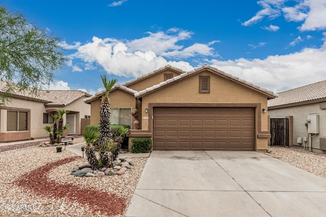 3703 S 73rd Dr, Phoenix, AZ 85043 - view of front of property with stucco siding, a garage, concrete driveway, and a tile roof