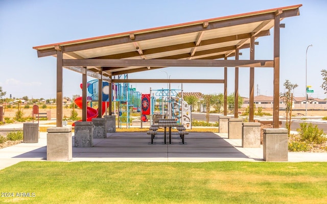 surrounding community featuring playground community and a lawn