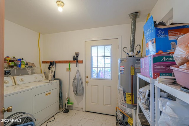 laundry area featuring water heater, laundry area, and separate washer and dryer