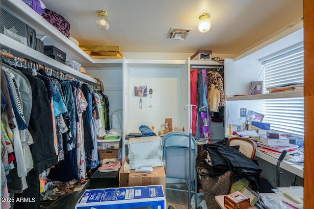 spacious closet featuring visible vents