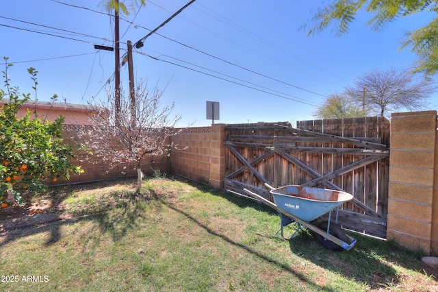 view of yard featuring a gate and fence