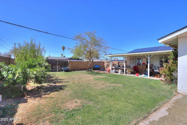 view of yard with a patio area and a fenced backyard