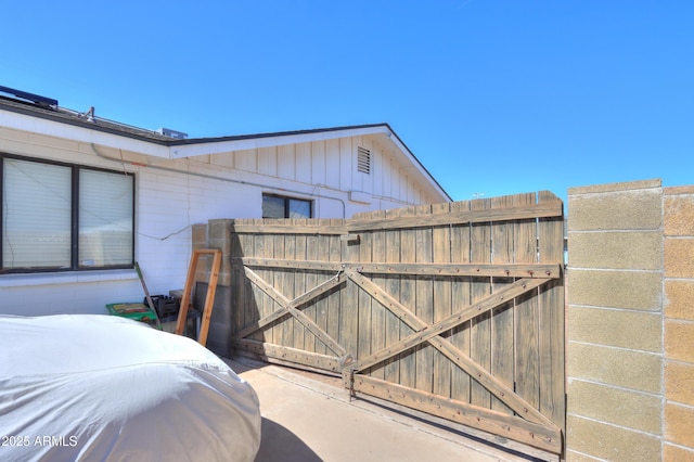 exterior space with fence and a gate