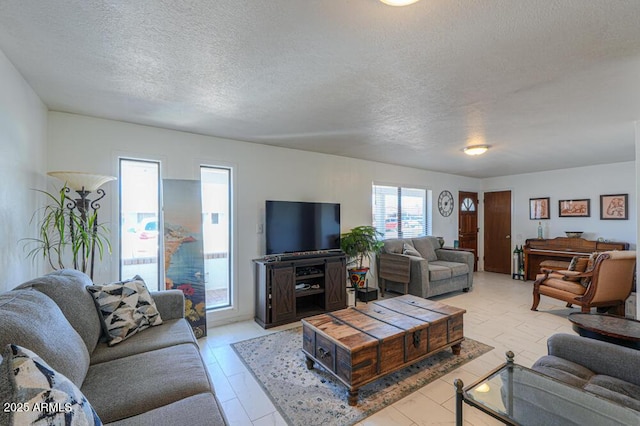 living area featuring a textured ceiling