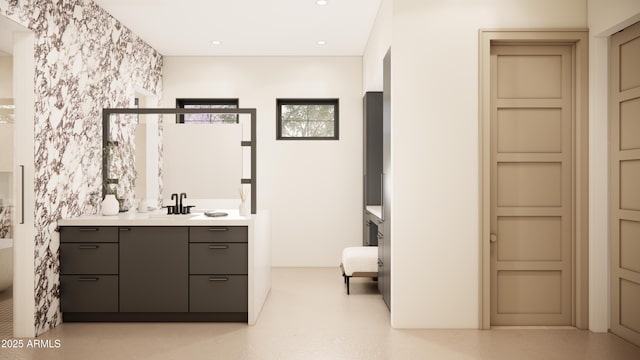 bathroom featuring vanity and a tub