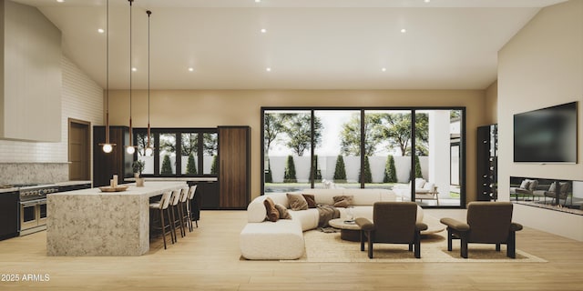 living room featuring light hardwood / wood-style flooring, a wealth of natural light, and high vaulted ceiling