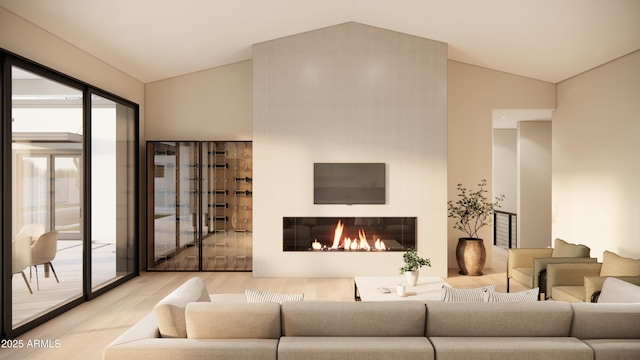 living room featuring vaulted ceiling and light hardwood / wood-style flooring